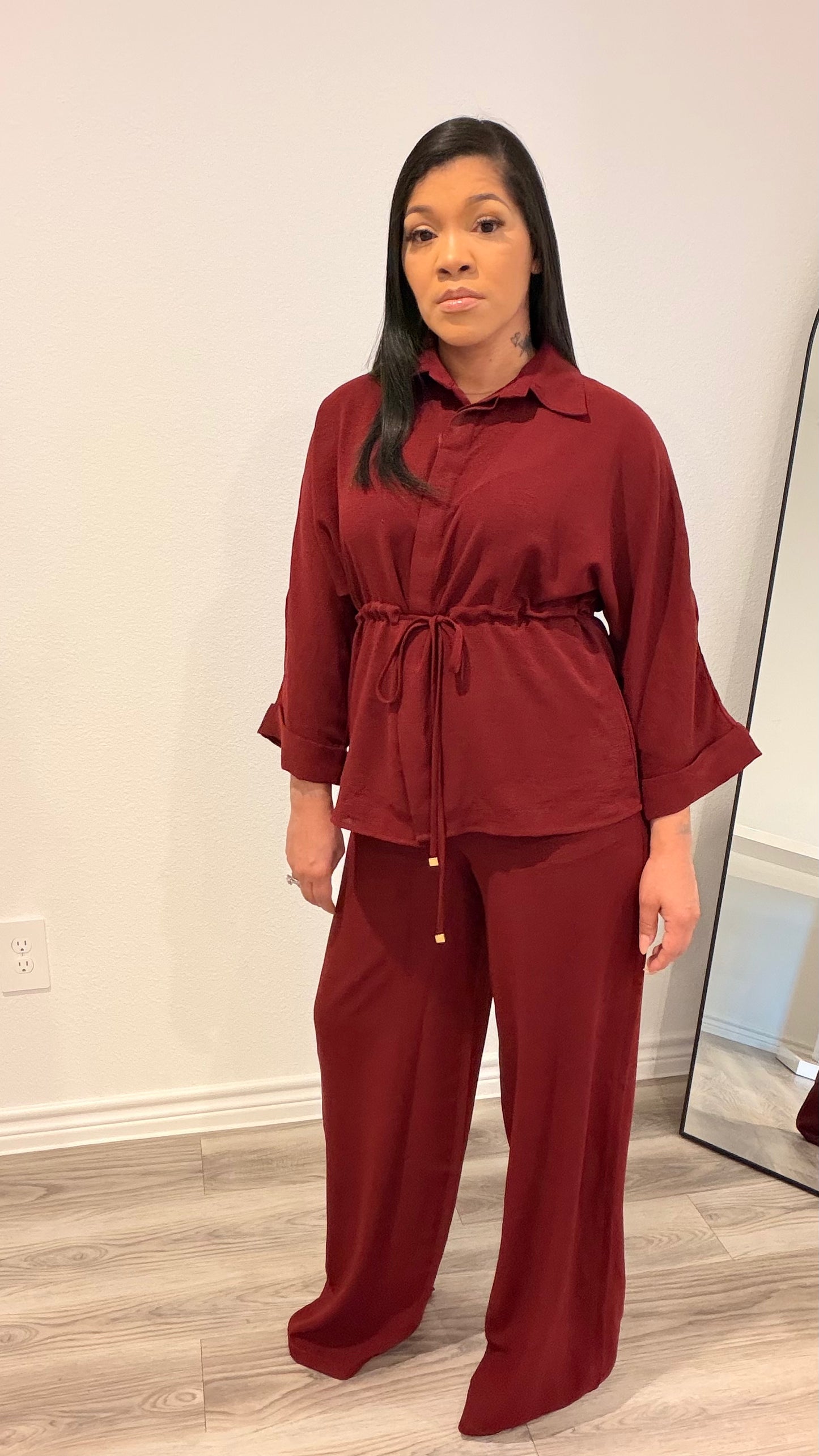 Woman wearing a relaxed drawstring two-piece set with a fluid silhouette.